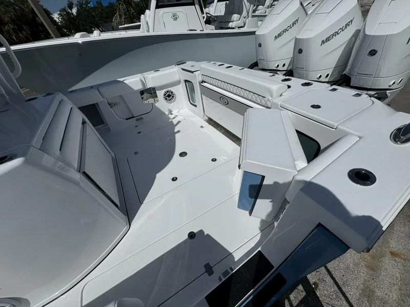 Slide: The Image of 2025 Sportsman 352 Open boat interior with Mercury engines, showcasing spacious deck and seating. - 6