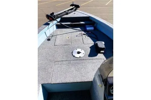 Slide: The Image of 1995 Tracker Pro Deep V-17 boat deck with trolling motor and storage compartments. - 2