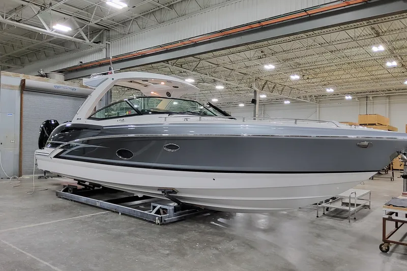 Slide: The Image of 2026 Formula 350 Crossover Bowrider OB in a showroom, showcasing sleek design and modern features. - 10