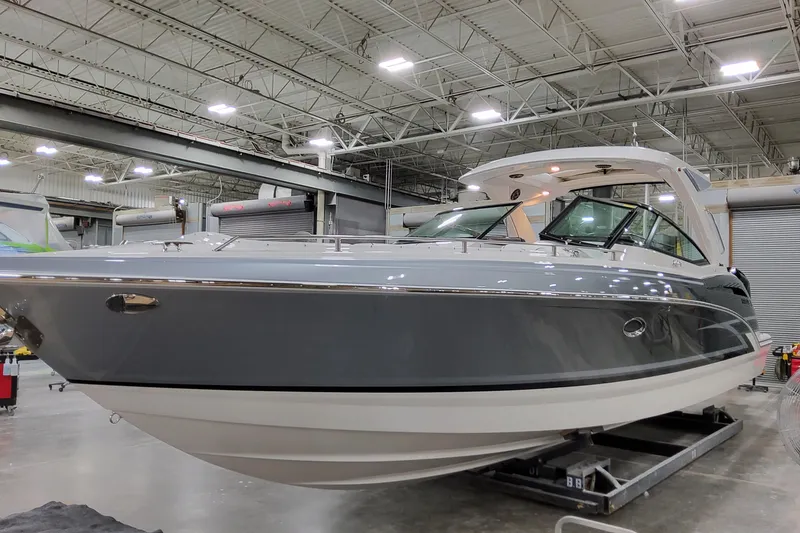 Slide: The Image of 2026 Formula 350 Crossover Bowrider OB in a showroom, showcasing sleek design and modern features. - 12