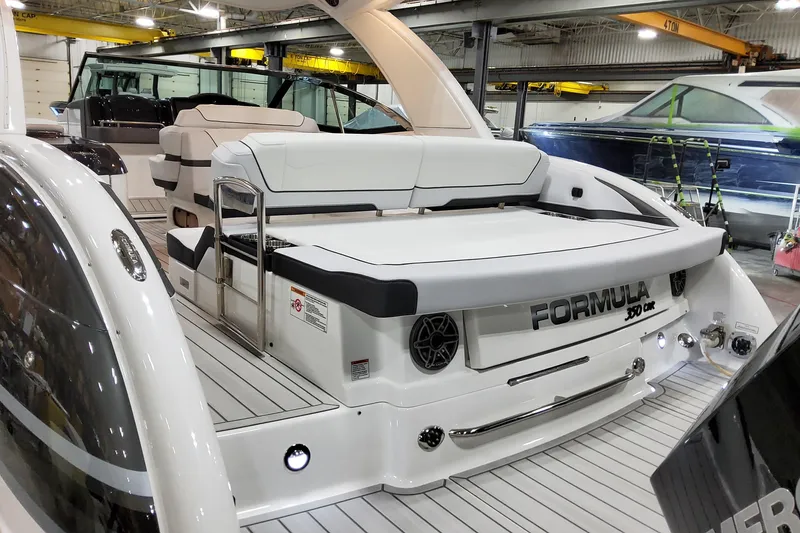 Slide: The Image of 2026 Formula 350 Crossover Bowrider OB in a showroom, showcasing sleek design and luxury features. - 13