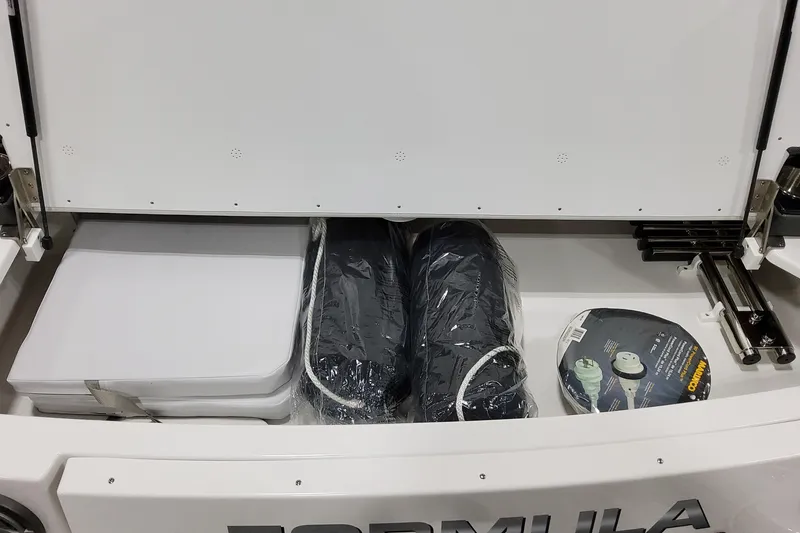 Slide: The Image of Storage compartment of 2026 Formula 350 Crossover Bowrider OB with accessories and equipment. - 15