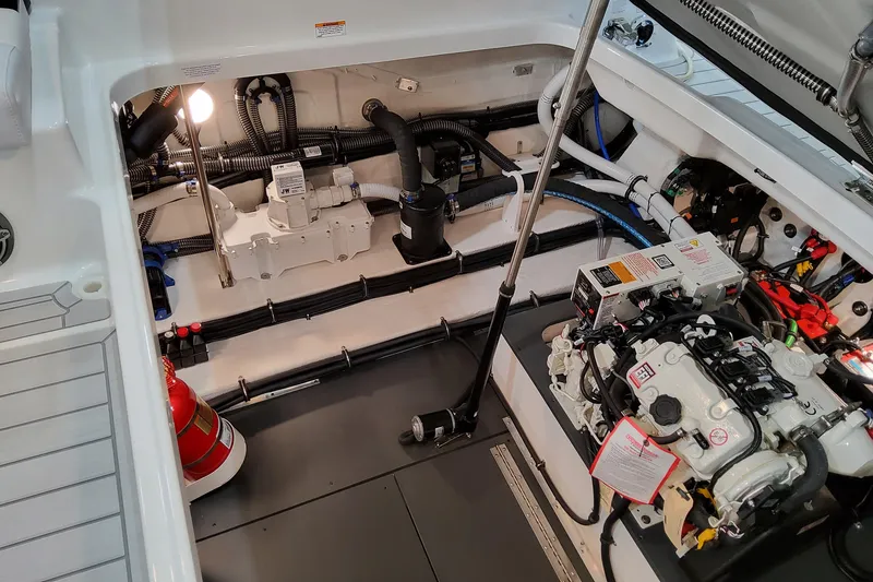 Slide: The Image of Engine compartment of 2026 Formula 350 Crossover Bowrider OB, showcasing mechanical components and wiring. - 20