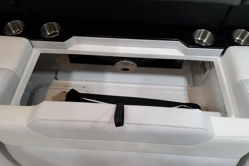 Slide: The Image of 2026 Formula 350 Crossover Bowrider OB storage compartment with cup holders and sleek design. - 26