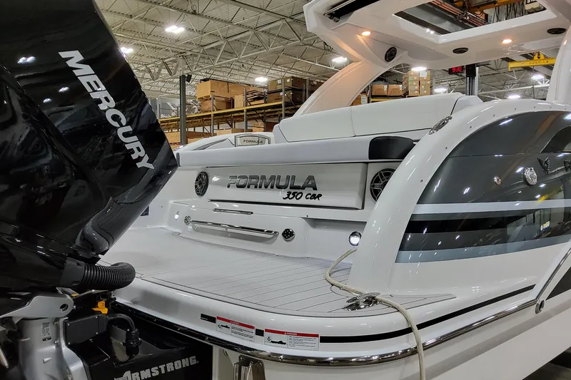 Slide: The Image of 2026 Formula 350 Crossover Bowrider OB in showroom, featuring Mercury outboard engine. - 3
