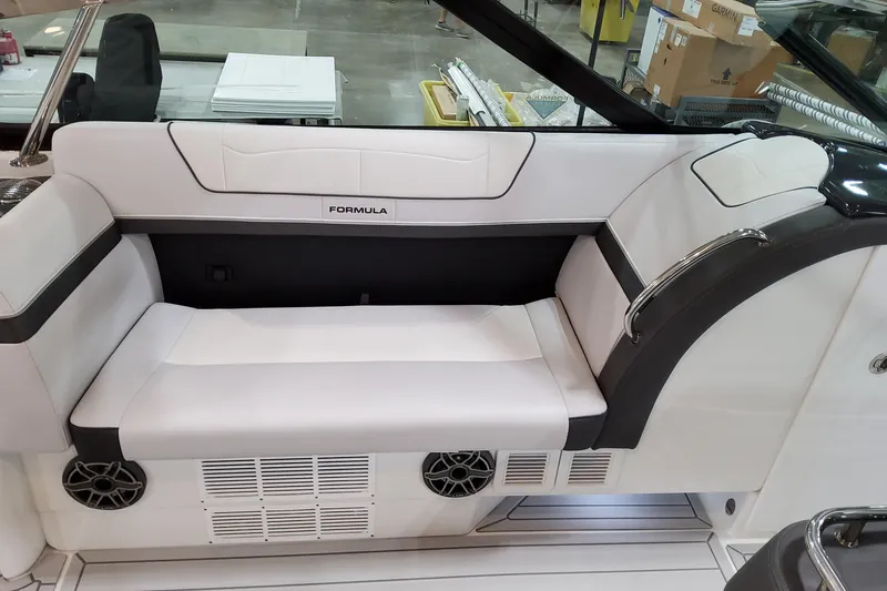 Slide: The Image of 2026 Formula 350 Crossover Bowrider OB interior seating with white upholstery and speaker system. - 31
