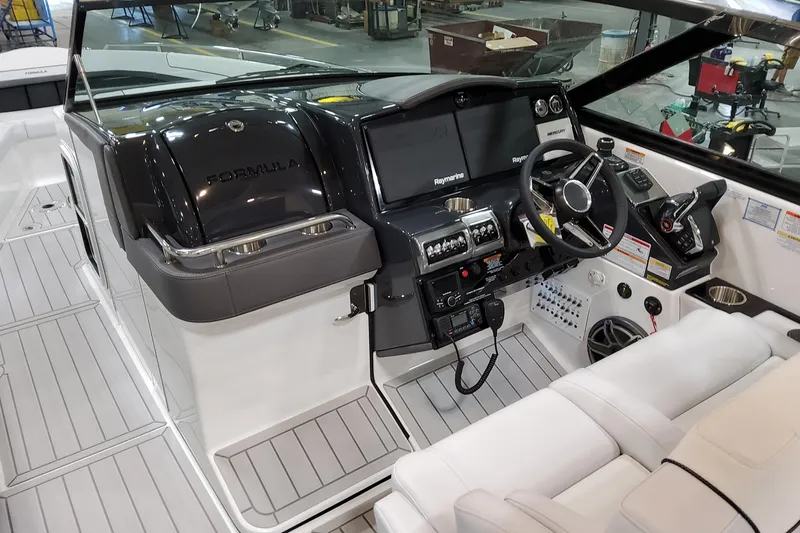 Slide: The Image of 2026 Formula 350 Crossover Bowrider OB cockpit with modern controls and sleek design. - 35