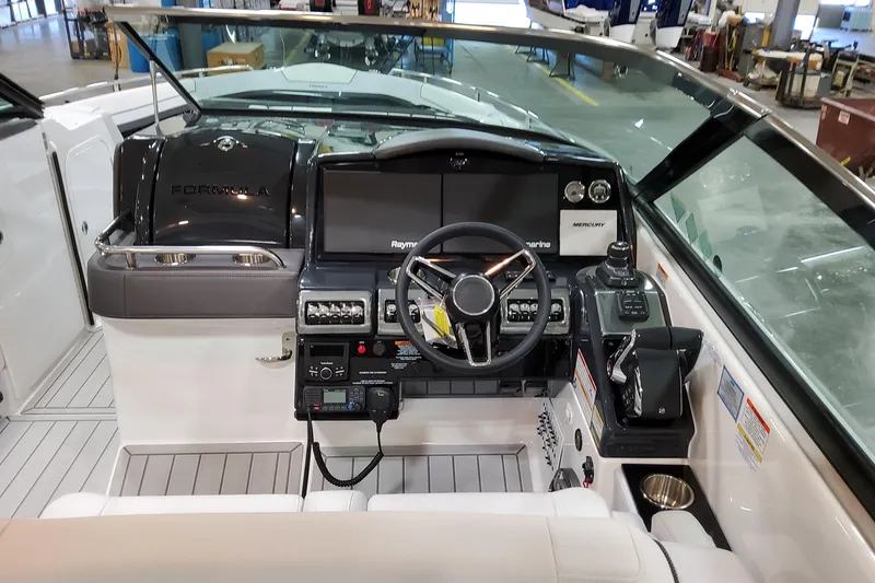 Slide: The Image of 2026 Formula 350 Crossover Bowrider OB cockpit with modern controls and navigation systems. - 36