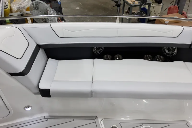 Slide: The Image of 2026 Formula 350 Crossover Bowrider OB interior seating with sleek white upholstery and cup holders. - 41