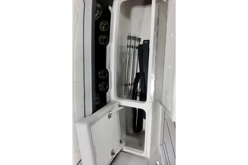 Slide: The Image of 2026 Formula 350 Crossover Bowrider OB storage compartment with cup holders and equipment storage. - 42