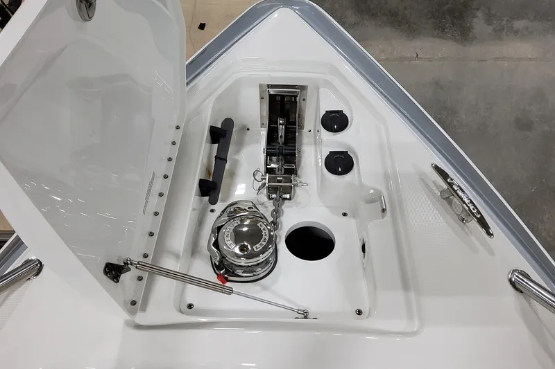 Slide: The Image of 2026 Formula 350 Crossover Bowrider OB anchor compartment with winch and cleat. - 49