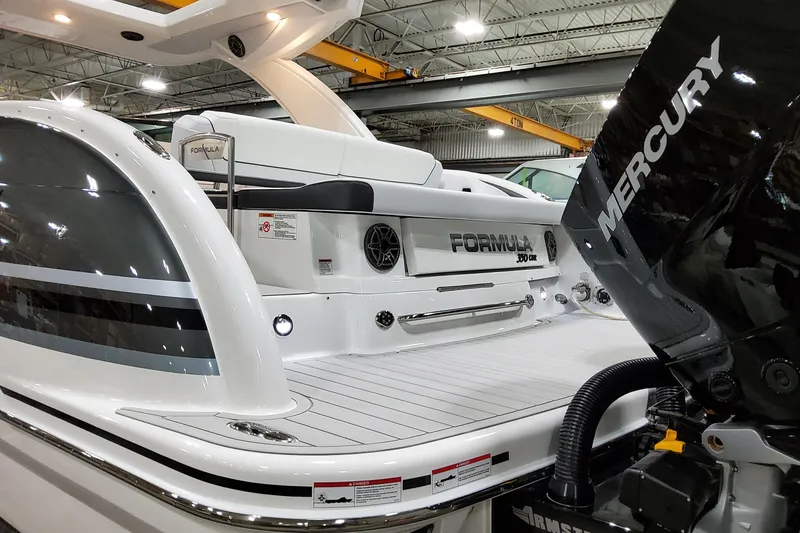 Slide: The Image of 2026 Formula 350 Crossover Bowrider OB with Mercury engine in showroom. - 5