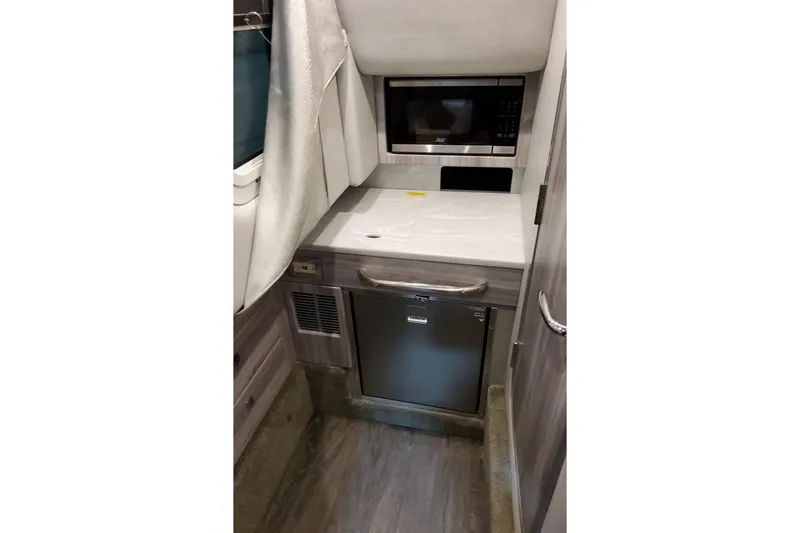 Slide: The Image of Interior of 2026 Formula 350 Crossover Bowrider OB with microwave and mini-fridge. - 55