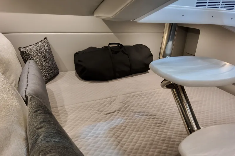 Slide: The Image of 2026 Formula 350 Crossover Bowrider OB cabin interior with bed and cushions. - 69