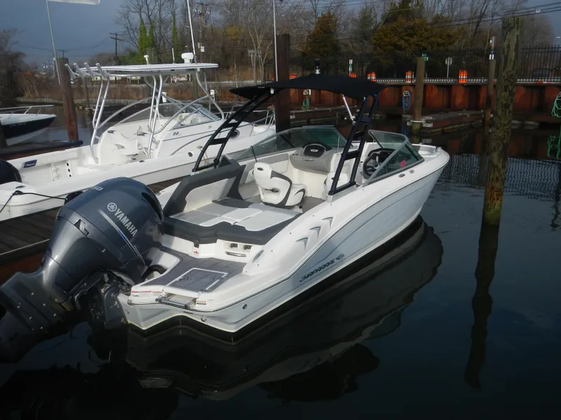 Slide: The Image of 2023 Chaparral 21 SSi OB boat docked with Yamaha outboard motor. - 1