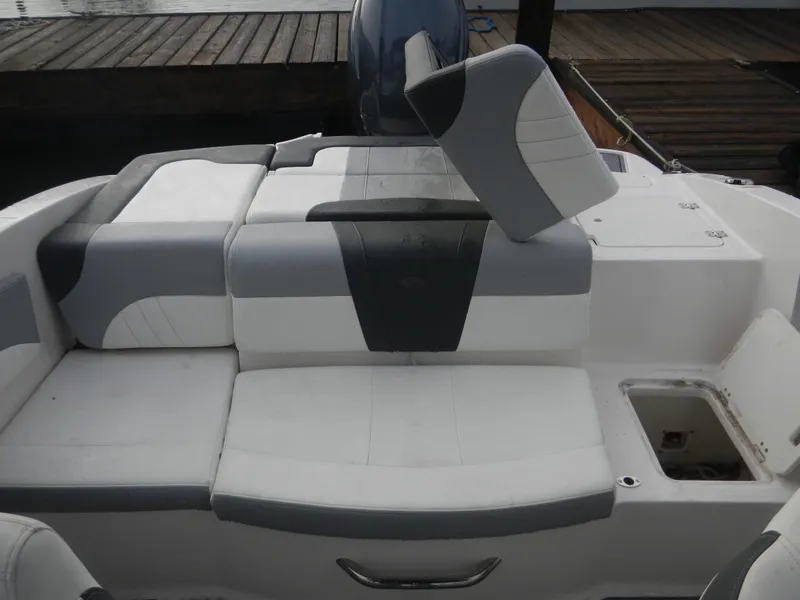 Slide: The Image of 2023 Chaparral 21 SSi OB boat interior with gray and white seating. - 10