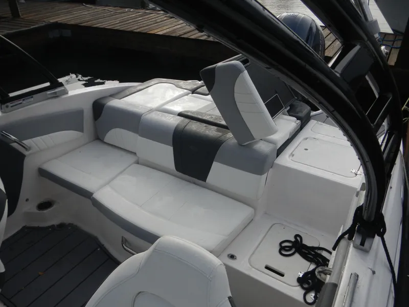 Slide: The Image of 2023 Chaparral 21 SSi OB boat interior with sleek seating and modern design. - 13