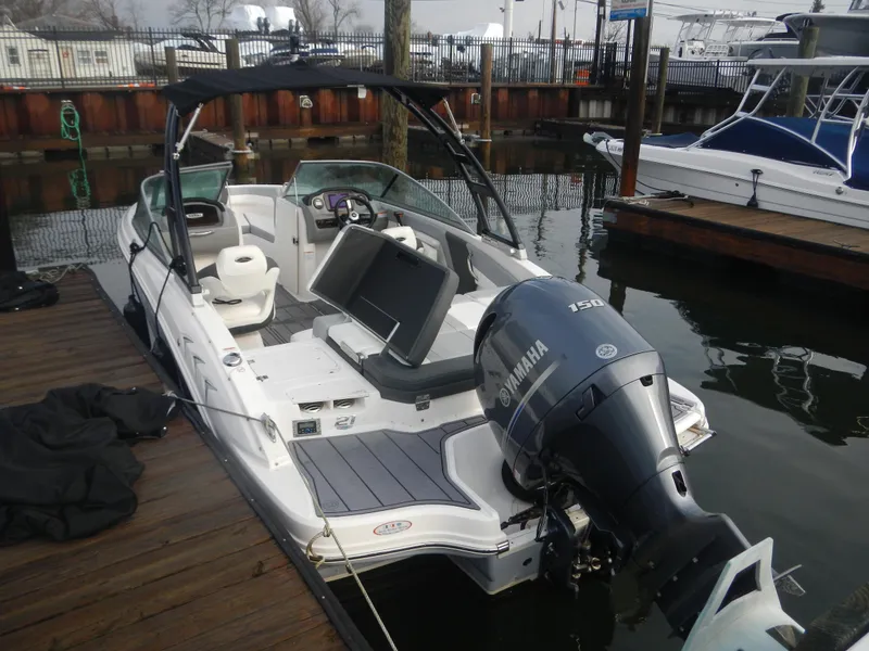 Slide: The Image of 2023 Chaparral 21 SSi OB boat docked, featuring Yamaha outboard motor. - 3