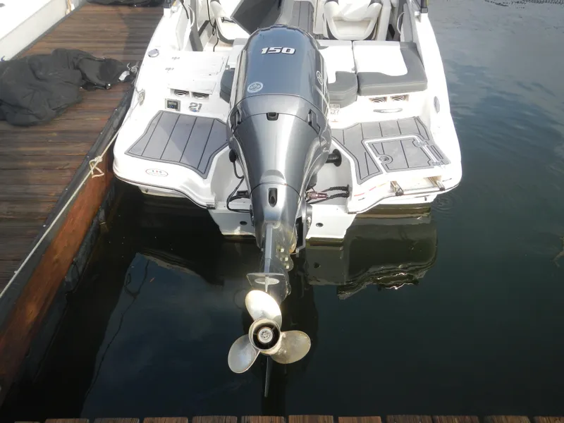 Slide: The Image of 2023 Chaparral 21 SSi OB boat with outboard motor at dock. - 5