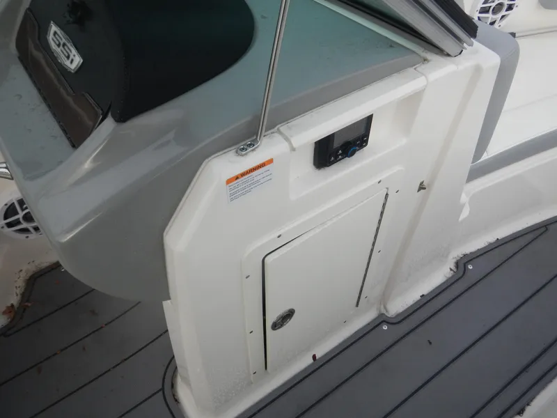 Slide: The Image of 2023 Chaparral 21 SSi OB boat interior detail with storage compartment. - 8