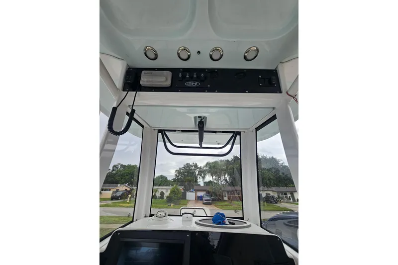 Slide: The Image of 2020 Sea Hunt BX 25 FS boat interior with control panel and navigation equipment. - 5