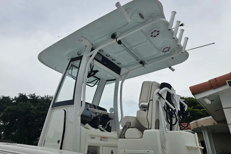 Slide: The Image of 2020 Sea Hunt BX 25 FS boat with T-top and seating, viewed from below. - 7