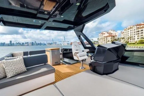 Slide: The Image of Luxurious 2021 OKEAN FB Motor Yacht interior with modern seating and scenic waterfront view. - 11