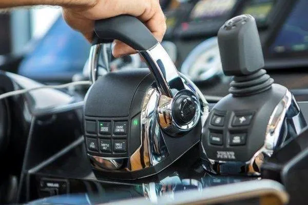 Slide: The Image of Hand operating controls on 2021 OKEAN FB Motor Yacht dashboard. - 13