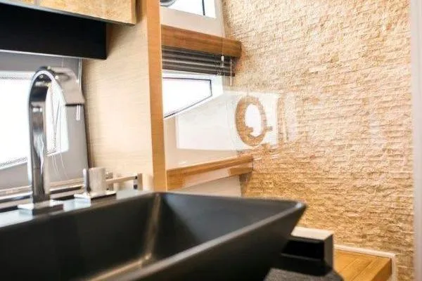 Slide: The Image of Modern bathroom interior of 2021 OKEAN FB Motor Yacht with sleek sink and textured walls. - 18