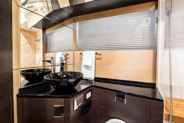 Slide: The Image of Luxurious bathroom interior of 2021 OKEAN FB Motor Yacht with modern black fixtures. - 19