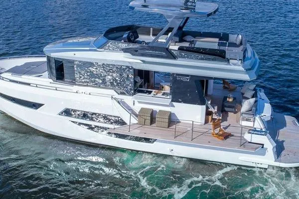 Slide: The Image of 2021 OKEAN FB Motor Yacht cruising on open water, showcasing sleek design and luxury features. - 6