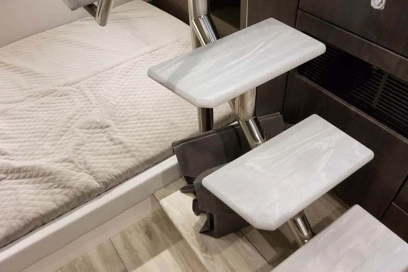 Slide: The Image of Interior of 2026 Formula 380 Super Sport Crossover OB with modern stairs and bedding. - 102