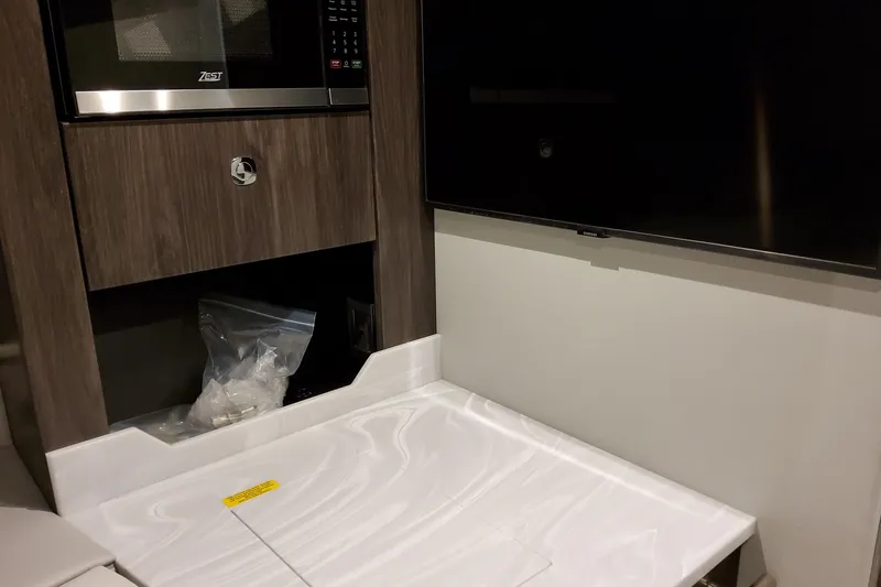 Slide: The Image of Interior of 2026 Formula 380 Super Sport Crossover OB with microwave and TV. - 108