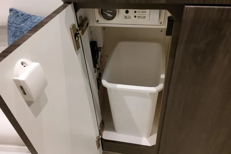 Slide: The Image of Cabinet with trash bin and control panel in 2026 Formula 380 Super Sport Crossover OB. - 112