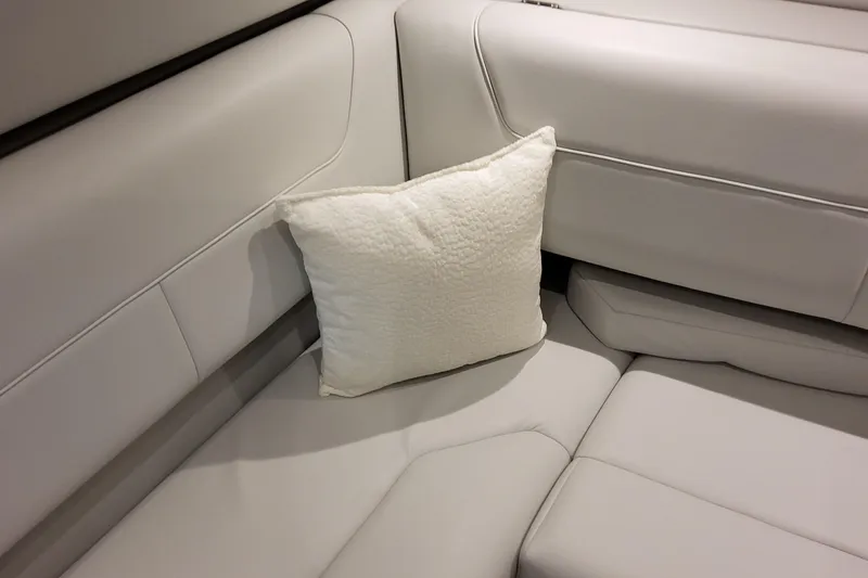 Slide: The Image of Luxurious white seating with a cushion in the 2026 Formula 380 Super Sport Crossover OB. - 114