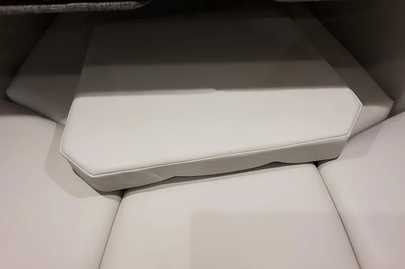 Slide: The Image of 2026 Formula 380 Super Sport Crossover OB interior seating detail, featuring white cushioned upholstery. - 116