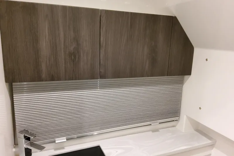 Slide: The Image of 2026 Formula 380 Super Sport Crossover OB interior with sleek wooden cabinets. - 122