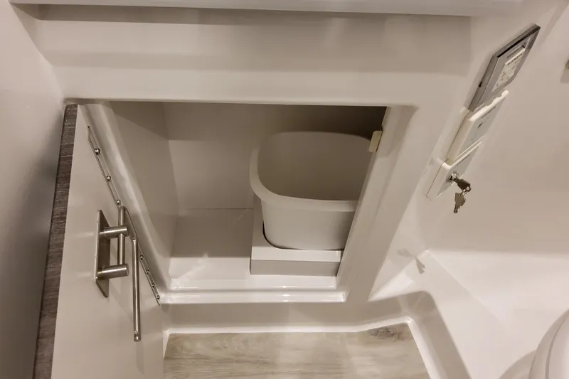 Slide: The Image of 2026 Formula 380 Super Sport Crossover OB interior storage compartment with sleek design. - 124