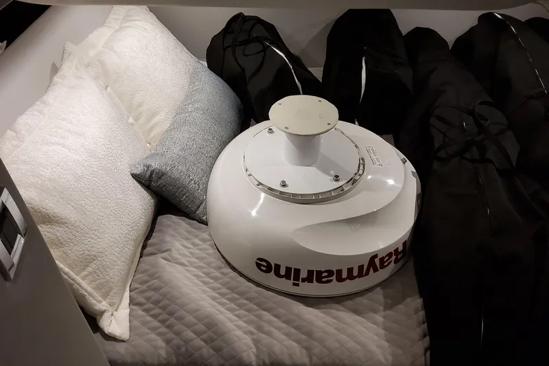 Slide: The Image of Cozy cabin interior of 2026 Formula 380 Super Sport Crossover OB with pillows and equipment. - 129