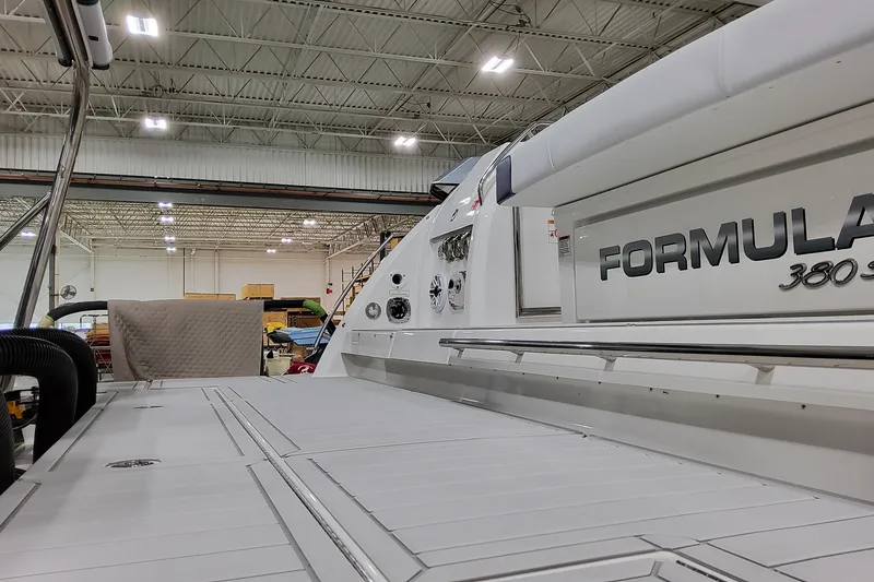 Slide: The Image of 2026 Formula 380 Super Sport Crossover OB in a spacious indoor facility. - 15