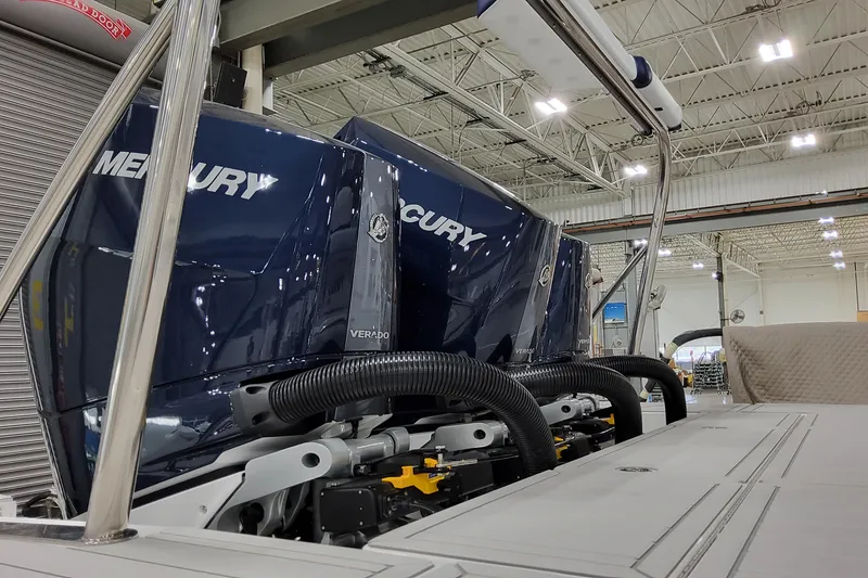 Slide: The Image of 2026 Formula 380 Super Sport Crossover OB with Mercury Verado outboard engines in a showroom. - 16