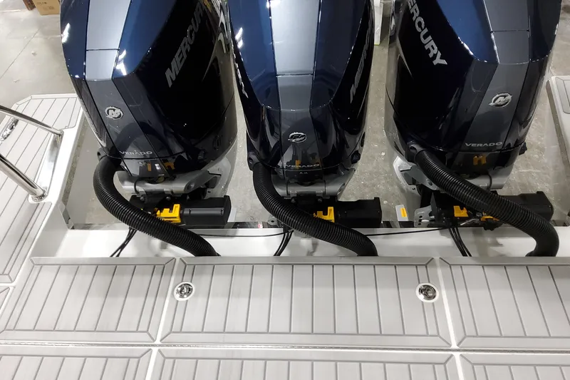 Slide: The Image of Triple Mercury outboard engines on a 2026 Formula 380 Super Sport Crossover OB boat. - 18