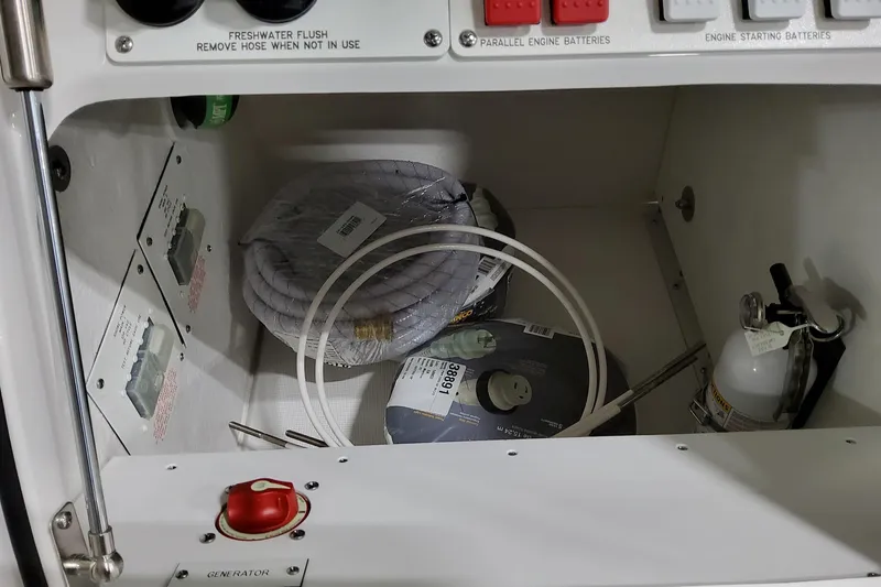 Slide: The Image of Storage compartment in 2026 Formula 380 Super Sport Crossover OB with safety equipment and accessories. - 22