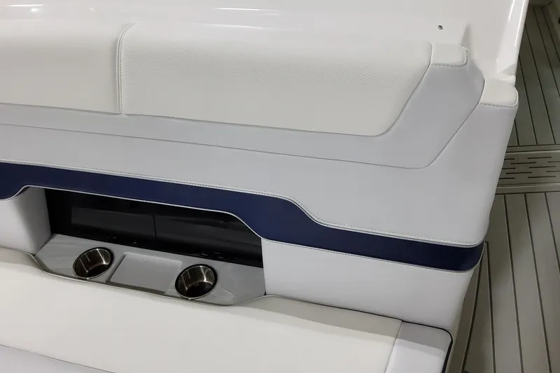Slide: The Image of 2026 Formula 380 Super Sport Crossover OB boat seating with integrated cup holders. - 28