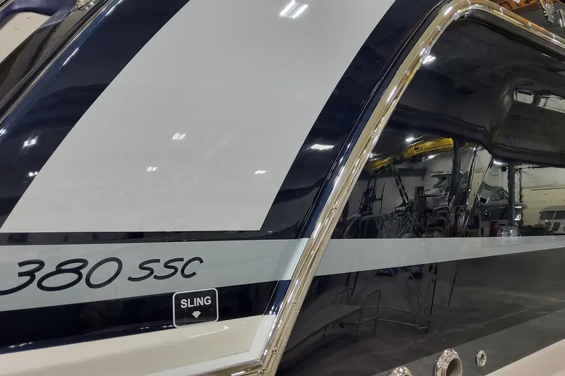 Slide: The Image of 2026 Formula 380 Super Sport Crossover OB boat detail in a showroom. - 3