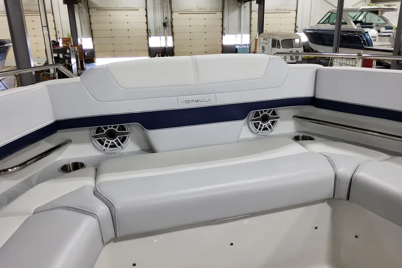 Slide: The Image of 2026 Formula 380 Super Sport Crossover OB boat interior with sleek seating and built-in speakers. - 32