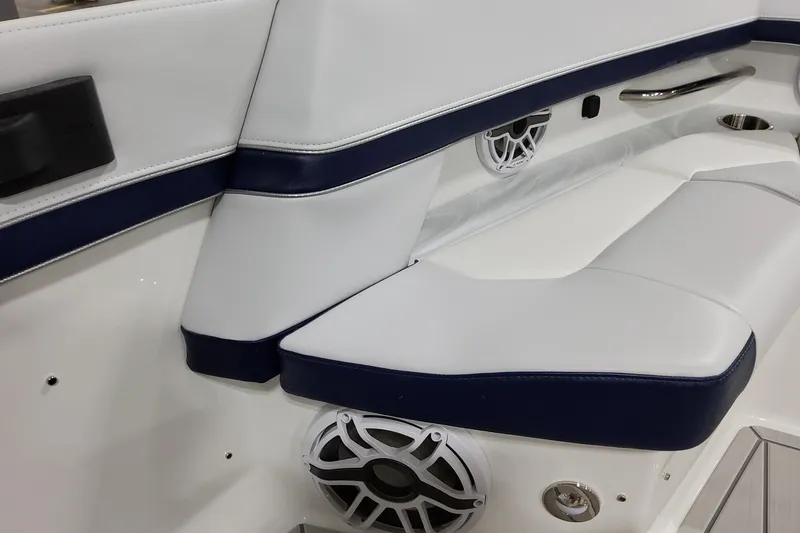 Slide: The Image of 2026 Formula 380 Super Sport Crossover OB interior seating with speakers and cup holder. - 34