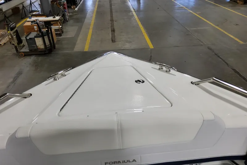 Slide: The Image of 2026 Formula 380 Super Sport Crossover OB boat in a workshop setting. - 35