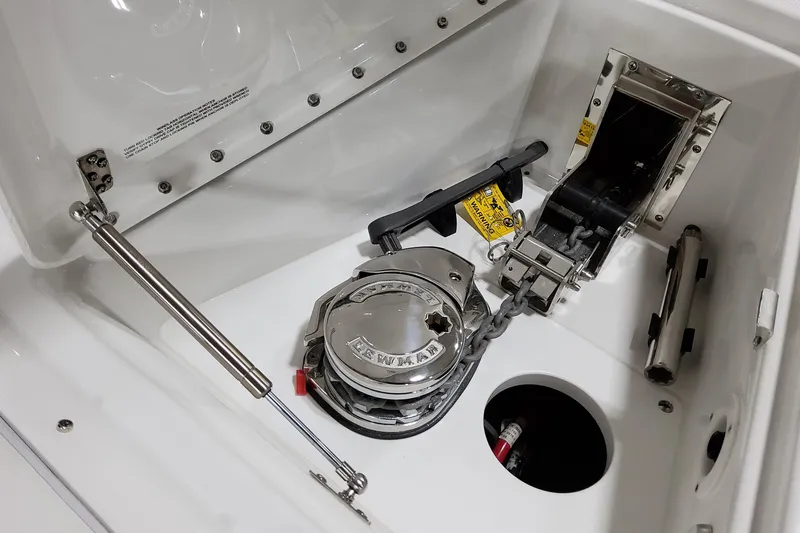 Slide: The Image of 2026 Formula 380 Super Sport Crossover OB anchor compartment with winch and chain mechanism. - 36