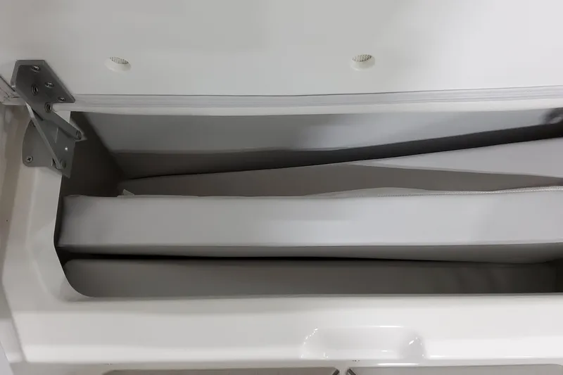 Slide: The Image of Storage compartment in 2026 Formula 380 Super Sport Crossover OB boat, featuring cushioned interior. - 38